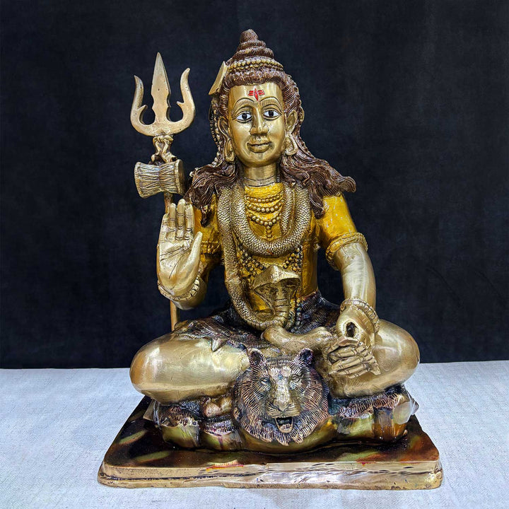 17.5 Inch Brass Lord Shiva Statue in Meditation Pose – A serene and majestic brass statue of Lord Shiva in deep meditation, embodying peace, spirituality, and divine energy. Perfect for home temples, meditation spaces, and spiritual décor. India’s Largest Pooja Accessories Brand – www.satvikworld.com