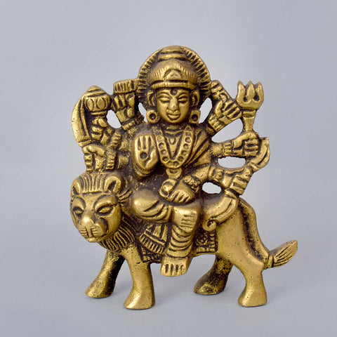 2.8-inch Maa Durga idol designed for car dashboard, showcasing the goddess in a powerful pose riding a lion, adorned with detailed ornaments and multiple arms holding divine weapons—radiating strength, protection, and divine grace. India’s Largest Pooja Accessories Brand- www.satvikworld.com