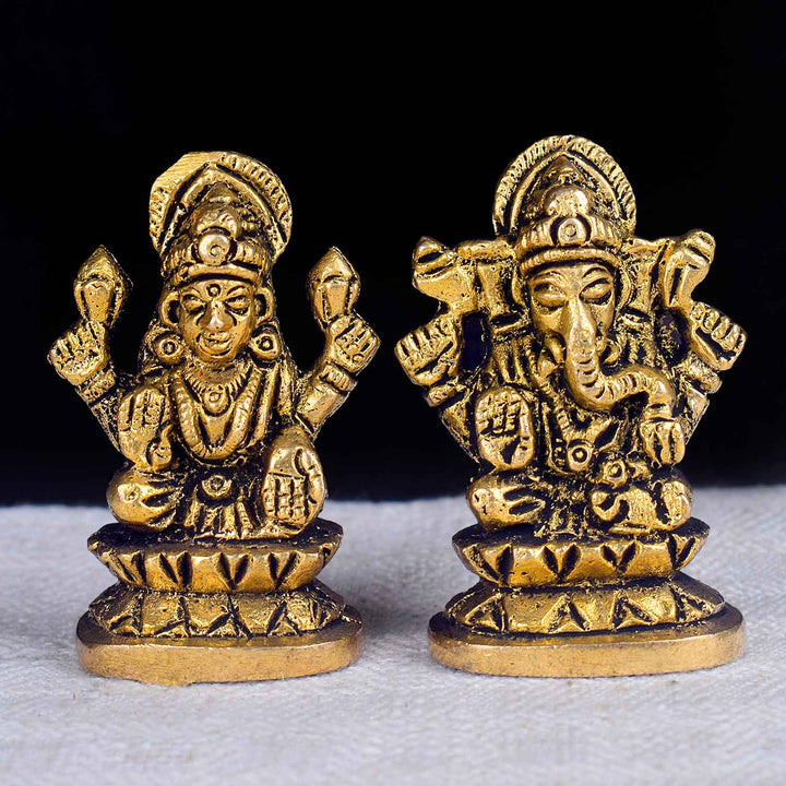 2-inch Laxmi Ganesh car dashboard idol featuring Goddess Laxmi and Lord Ganesha seated side by side with intricate detailing, vibrant colors, and traditional ornaments—symbolizing prosperity and wisdom, ideal for car or home decor. India’s Largest Pooja Accessories Brand- www.satvikworld.com