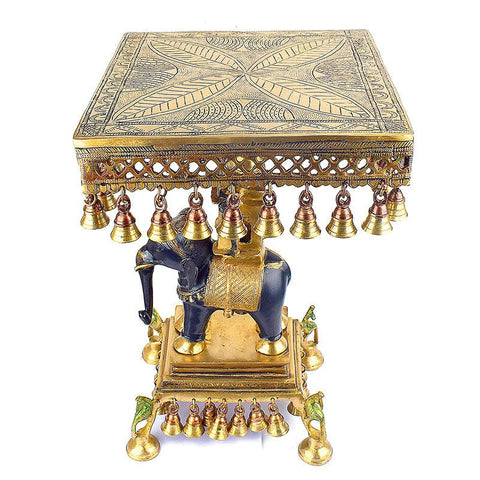 23 Inch Brass Chowki on Elephant with Hanging Bells – A stunning and intricately crafted brass chowki placed on an elephant, adorned with hanging bells, perfect for home temples, spiritual spaces, and as a unique decorative accent. India’s Largest Pooja Accessories Brand – www.satvikworld.com