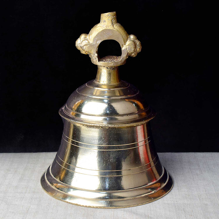 4.7-inch authentic brass temple bell (mandir ghanta), finely crafted with a sturdy handle and rich sound, ideal for daily worship and temple rituals. India’s Largest Pooja Accessories Brand – www.satvikworld.com