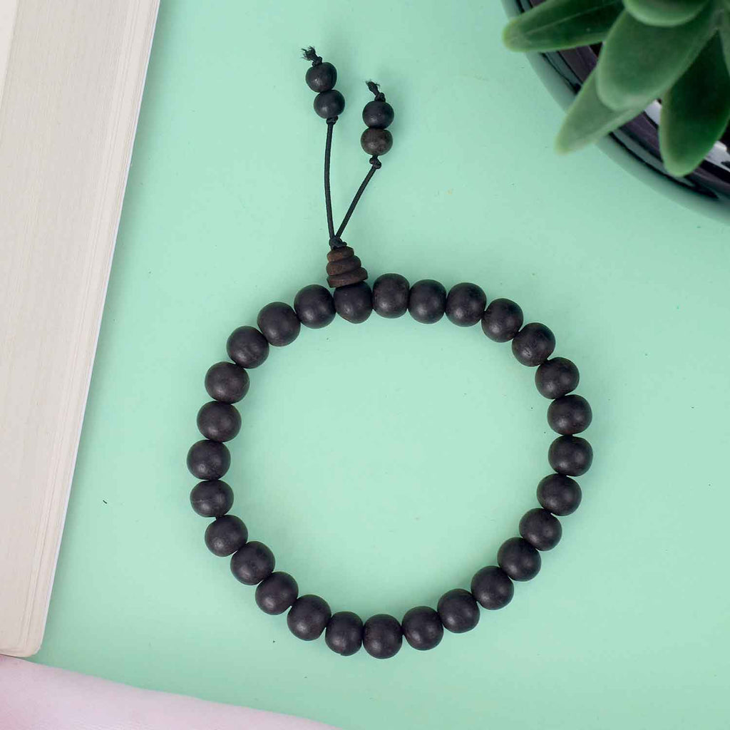 8mm Ebony Bracelet with Matt Finish – smooth black wooden beads with a non-reflective surface, offering a subtle and elegant spiritual accessory. India’s Largest Pooja Accessories Brand - www.satvikworld.com