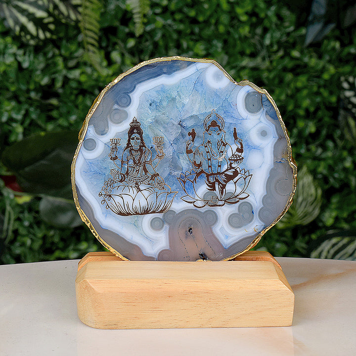 Agate Stone Stand featuring divine Laxmi and Ganesha artwork on a natural agate crystal base India’s Largest Pooja Accessories Brand – www.satvikworld.com