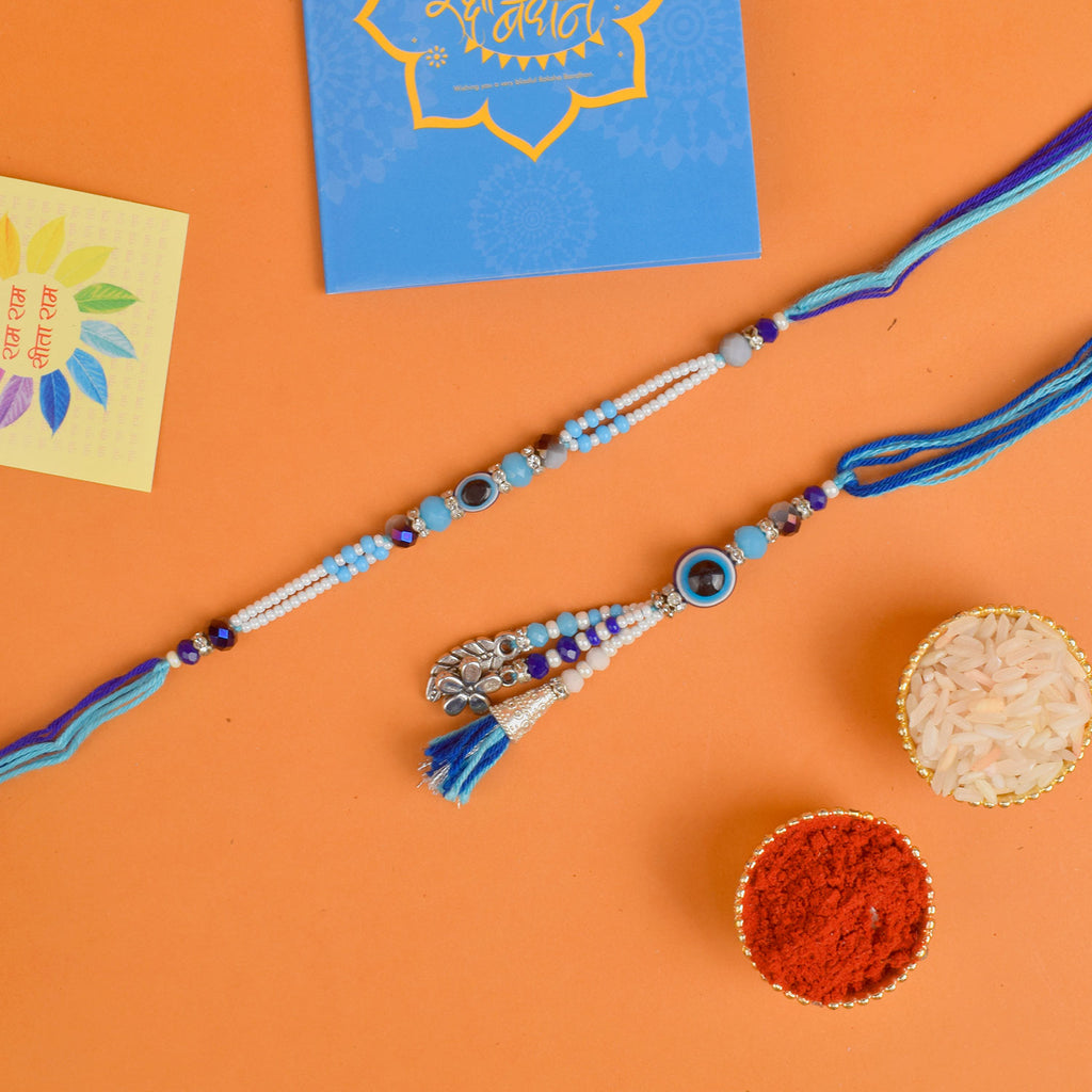 Designer Couple Rakhi Set for Bhaiya and Bhabhi with Roli Chawal and Ram Sita Stickers – Raksha Bandhan Gift Combo. India’s Largest Brass Idols Brand - www.satvikworld.com