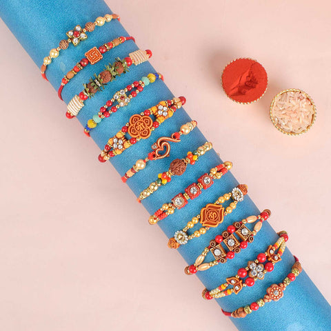 Assortment of 12 Rakhis, featuring different designs, threads, and embellishments for Raksha Bandhan. India’s Largest Pooja Accessories Brand - www.satvikworld.com