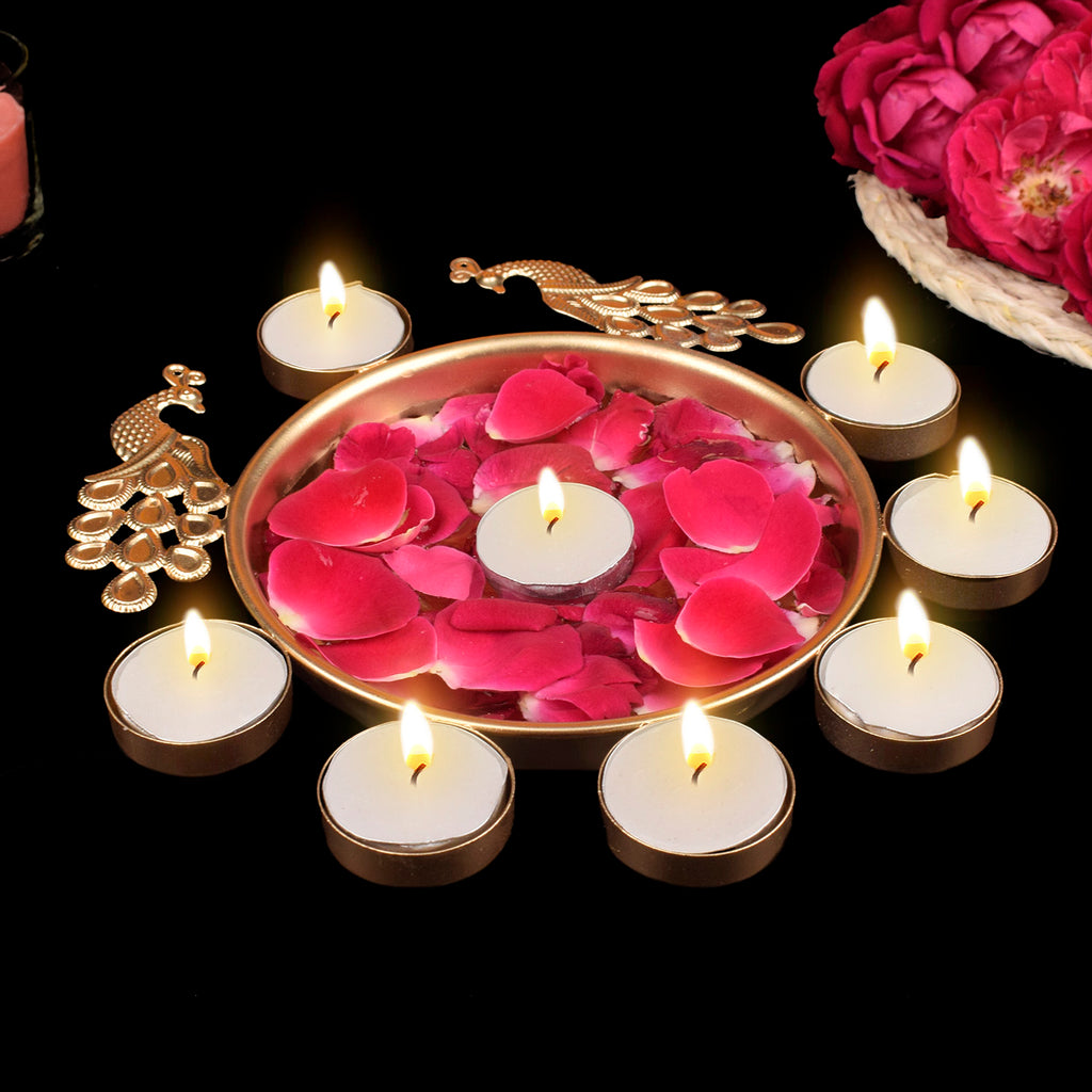 Decorative metal peacock-themed flower urli bowl with elegant design and tea light candle, ideal for festive and traditional home decor. India’s Largest Pooja Accessories Brand – www.satvikworld.com