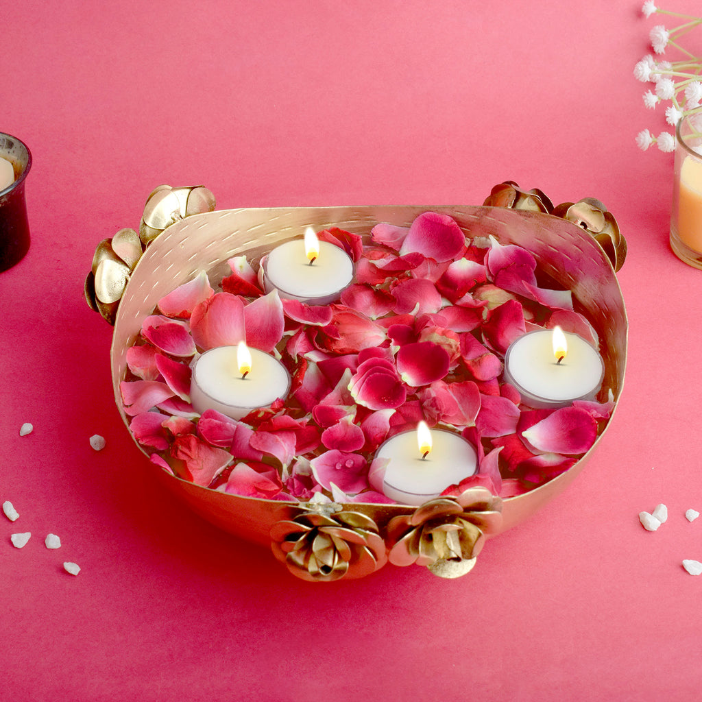Elegant gold-finished metal urli bowl with intricate floral design, ideal for floating candles, flowers, or festive home décor. India’s Largest Pooja Accessories Brand – www.satvikworld.com