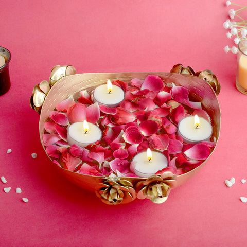 Elegant gold-finished metal urli bowl with intricate floral design, ideal for floating candles, flowers, or festive home décor. India’s Largest Pooja Accessories Brand – www.satvikworld.com