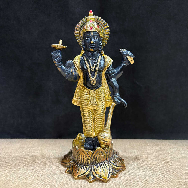 7-inch majestic Lord Vishnu Ji statue, beautifully crafted in black and gold, symbolizing divine presence, protection, and cosmic harmony. Ideal for pooja rooms, home temples, or as a spiritual gift to invoke blessings and peace. India’s Largest Pooja Accessories Brand – www.satvikworld.com