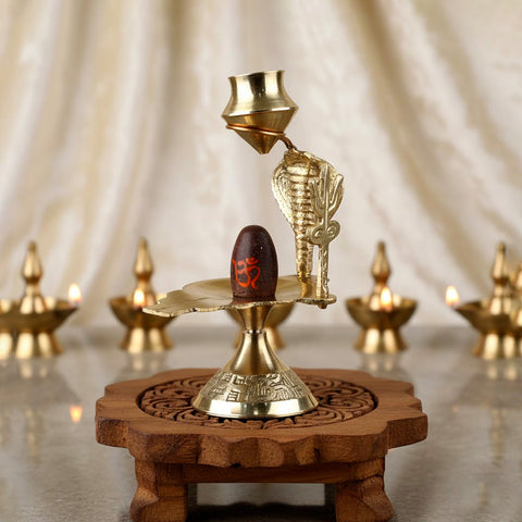 Small pure brass Narmadeshwar Shivling with sacred yoni base, ideal for pooja and divine blessings. India’s Largest Pooja Accessories Brand – www.satvikworld.com