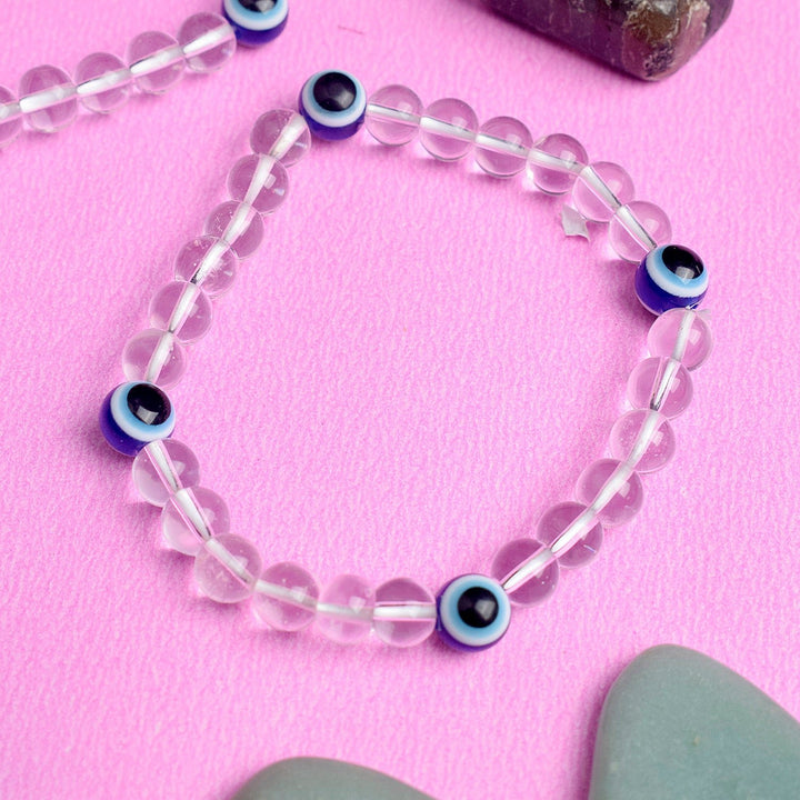  Pure Radiance Authentic Clear Quartz Bracelet with Evil Eye Charm in 8MM Beads for Positive Energy and Protection. 
India’s Largest Pooja Accessories Brand – www.satviksatvik.in
