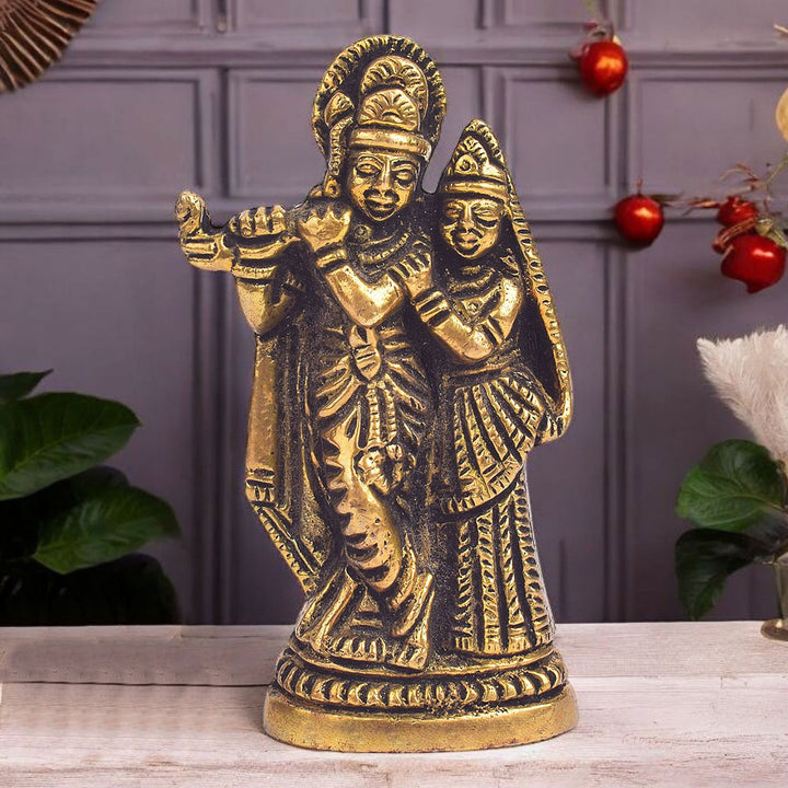 3.7-inch Radha Krishna idol pair intricately crafted with vibrant colors, depicting Lord Krishna playing the flute while Radha gazes lovingly at him. The detailed figures capture the divine bond of love and devotion, perfect for home altars or spiritual spaces. India’s Largest Pooja Accessories Brand- www.satvikworld.com