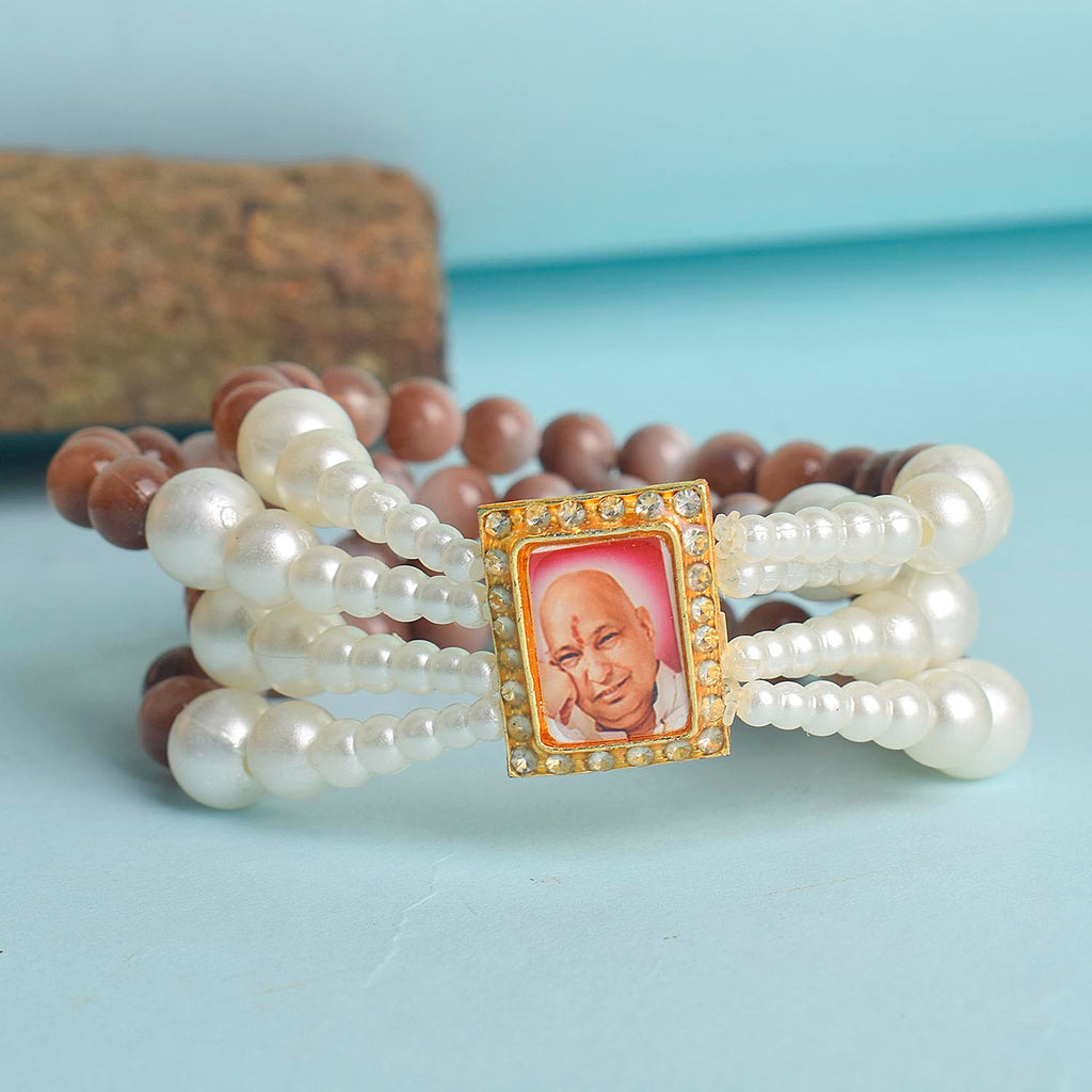 Wine & White Pearl Four Layer Guruji Swaroop Bracelet featuring luxurious wine-colored beads and luminous white pearls with Jai Guruji Swaroop – perfect for spiritual wear, festive gifting, and daily devotion. India’s Largest Pooja Accessories Brand – www.satvikworld.com