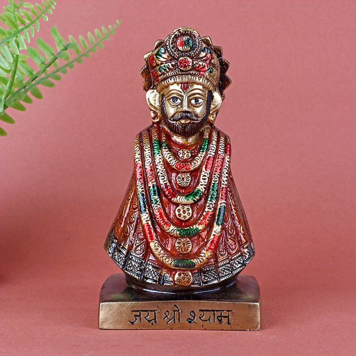 Colorful brass idol of Shree Khatu Shyam Ji depicted in a traditional standing posture, adorned with vibrant hues and intricate detailing. India’s Largest Pooja Accessories Brand – www.satvikworld.com