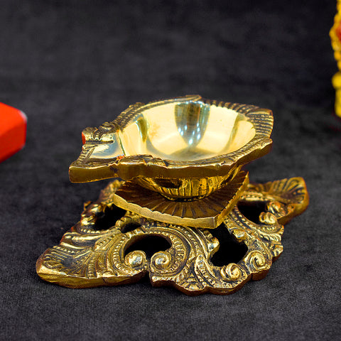 Elegant designer brass Diya with intricate detailing, perfect for religious ceremonies, home decor, and festive celebrations like Diwali  India’s Largest Pooja Accessories Brand – www.satvikworld.com