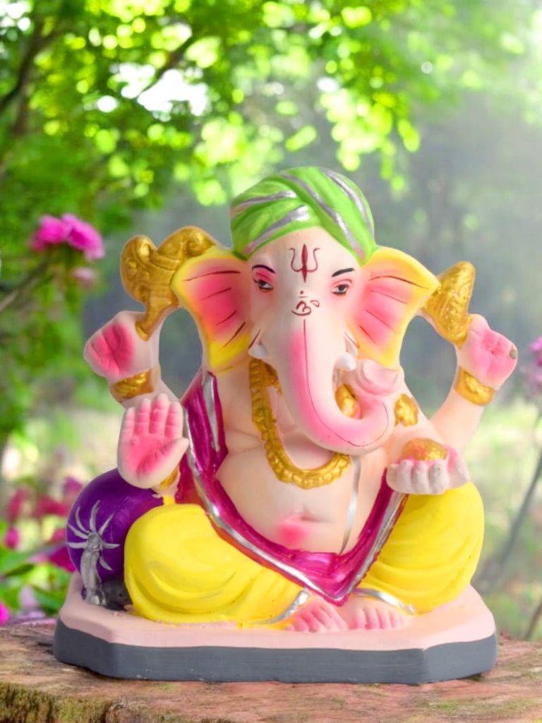 6-inch eco-friendly Ganesha idol seated in Padmasana pose, hand-painted in vibrant colors, made from biodegradable shadu mati clay, ideal for small home temples and festive decor. India’s Largest Pooja Accessories Brand – www.satvikworld.com