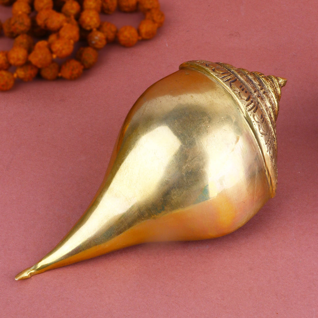 Handcrafted brass Shankh (conch shell) with intricate detailing, symbolizing purity and auspiciousness in Hindu rituals. Ideal for spiritual ceremonies and home décor. India’s Largest Pooja Accessories Brand – www.satvikworld.com