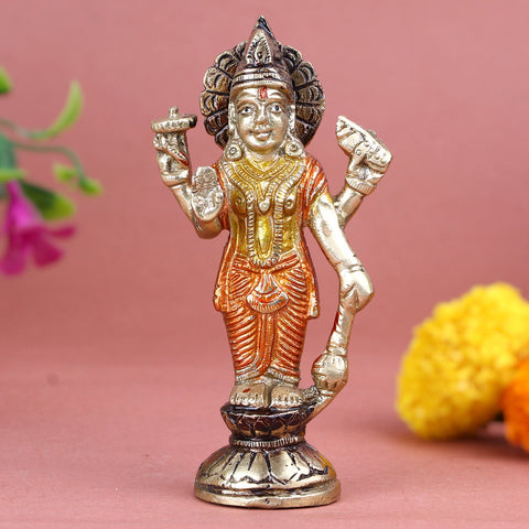 Elegant brass idol of Lord Vishnu in a standing posture, intricately crafted with traditional ornaments, a serene expression, and symbolic attributes like the conch, discus, mace, and lotus—representing protection, preservation, and divine balance, ideal for worship or décor. India’s Largest Pooja Accessories Brand- www.satvikworld.com