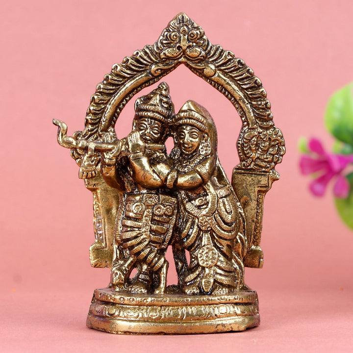 Brass Radha Krishna idol, beautifully crafted with intricate details, depicting Lord Krishna and Radha in a divine and loving embrace, symbolizing love, devotion, and spiritual harmony. Ideal for worship or home décor. India’s Largest Pooja Accessories Brand – www.satvikworld.com