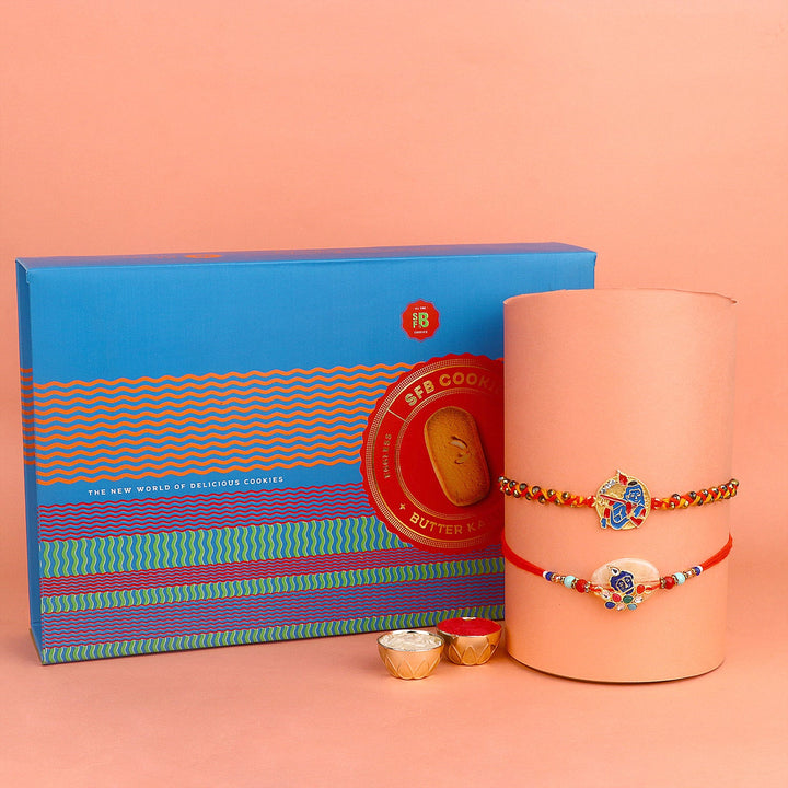 Image of a beautifully designed Rakhi with sweets, the perfect combination of tradition and sweetness for Raksha Bandhan celebration. Shop now at SatvikStore.in. #Rakhi #RakhiOnline #SendRakhi #DesignerRakhi #BeautifulRakhi #LatestRakhi #NewRakhi #ModernRakhi"