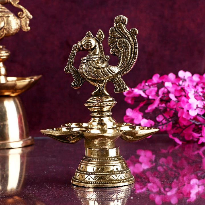 Peacock Panchmukhi Brass Diya featuring intricate detailing and five flame holders, perfect for auspicious Diwali celebrations and spiritual rituals. India’s Largest Pooja Accessories Brand – www.satvikworld.com